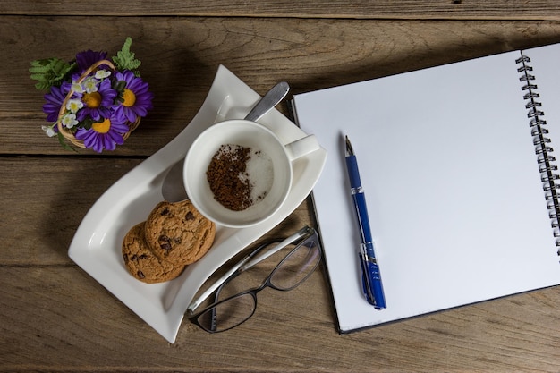 contact desk with notebook and pen